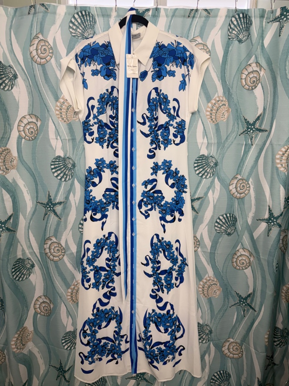 Sleeveless White Maxi Dress with Blue Floral Motif